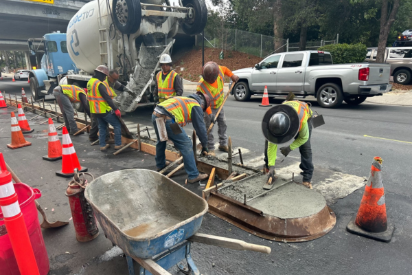 A picture of a construction pouring concrete on bike medians as a part of San Luis Obispo's North Chorro Neighborhood Greenway project.